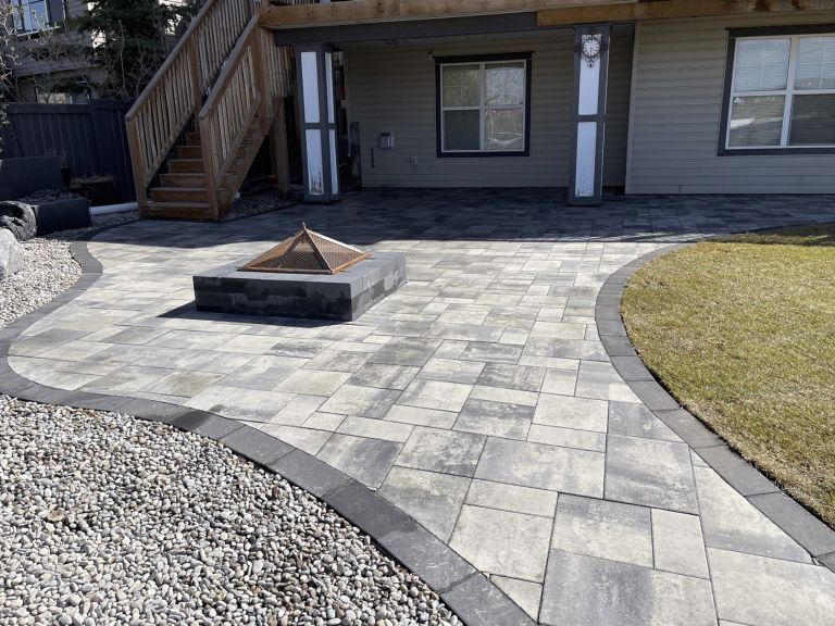 Backyard firepit on stone patio 768x576
