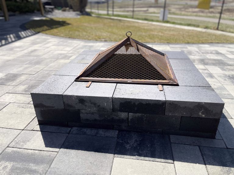 Backyard firepit on stone patio close up 768x576