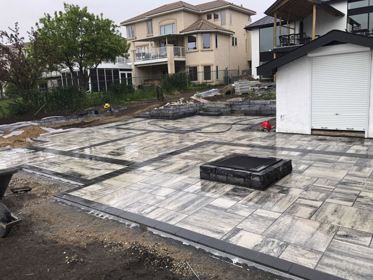 Backyard firepit placed on stone patio 768x576