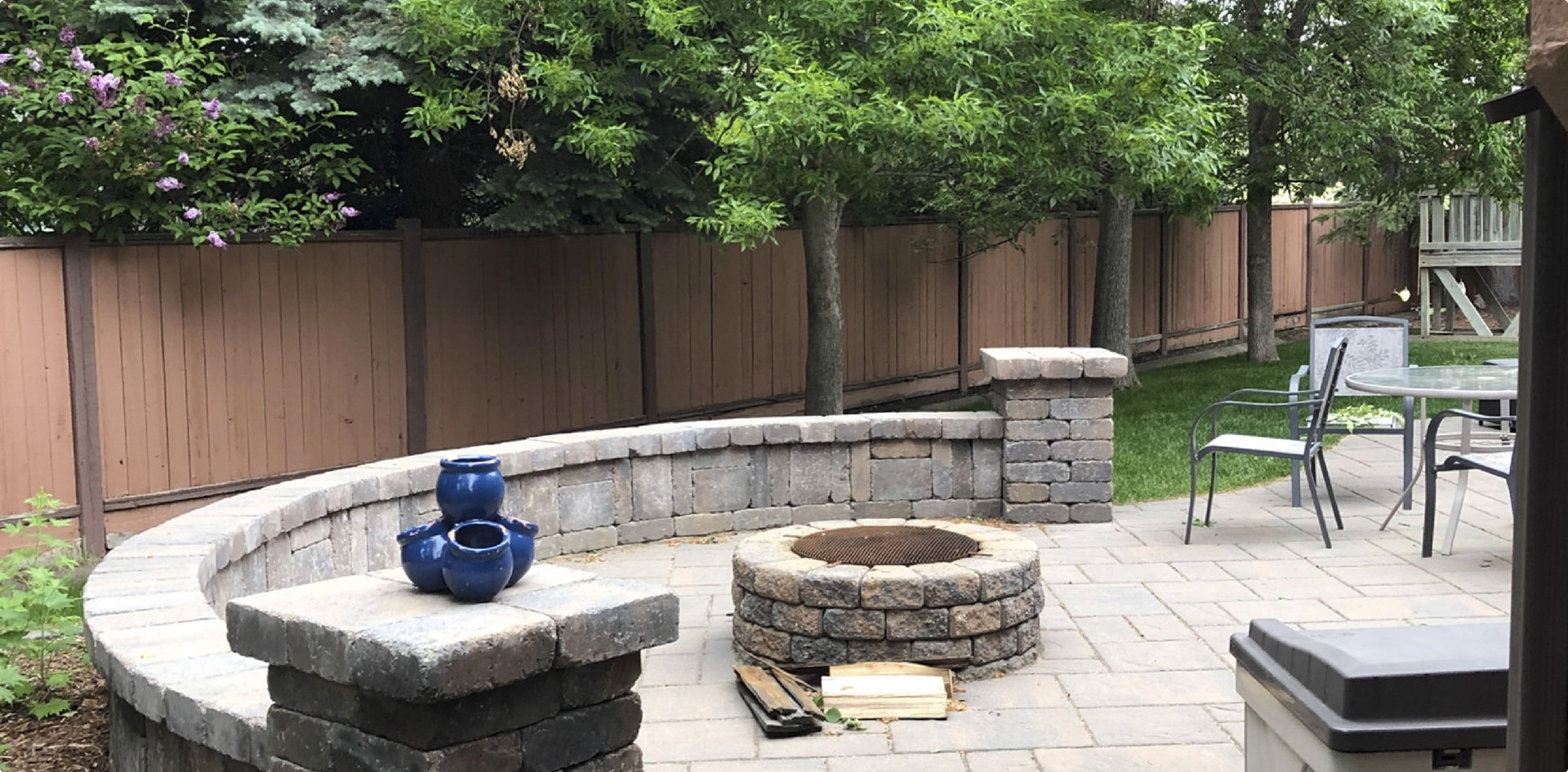 Backyard firepit with stone patio