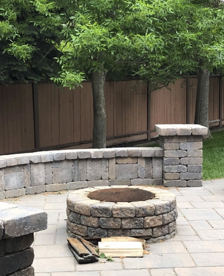 Backyard firepit with stone patio mobile
