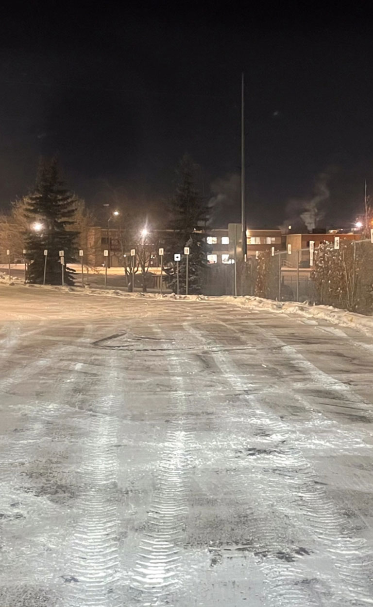 Industrial parking log cleared of snow mobile