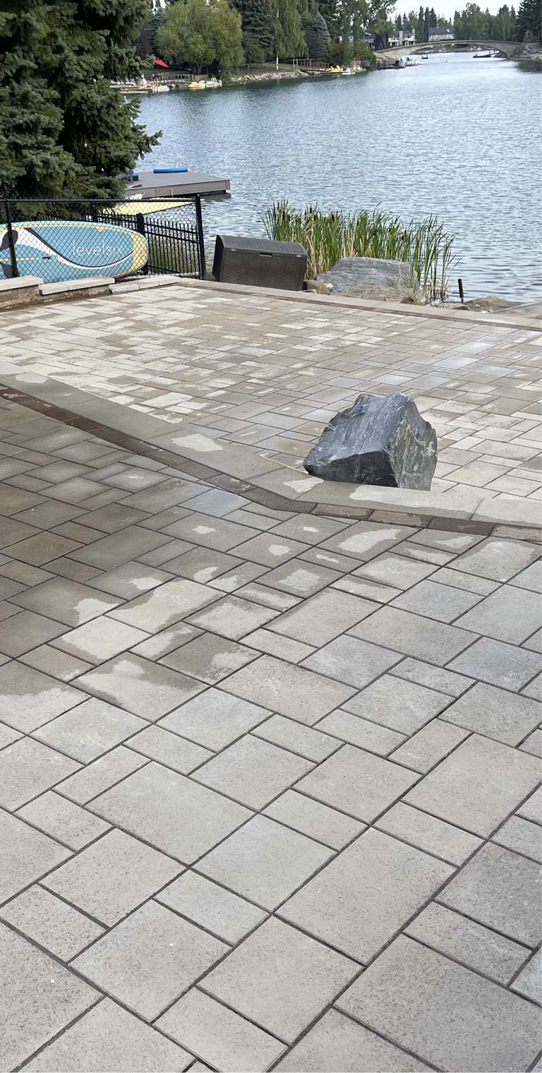 Landscaped patio with pavers mobile