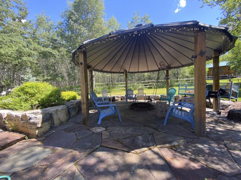 Large outdoor firepit with stone patio 768x576