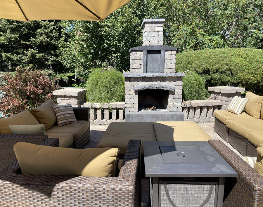 Outdoor patio with stone fireplace