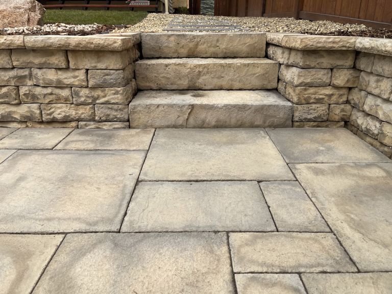 Retaining wall with stone steps closeup 768x576