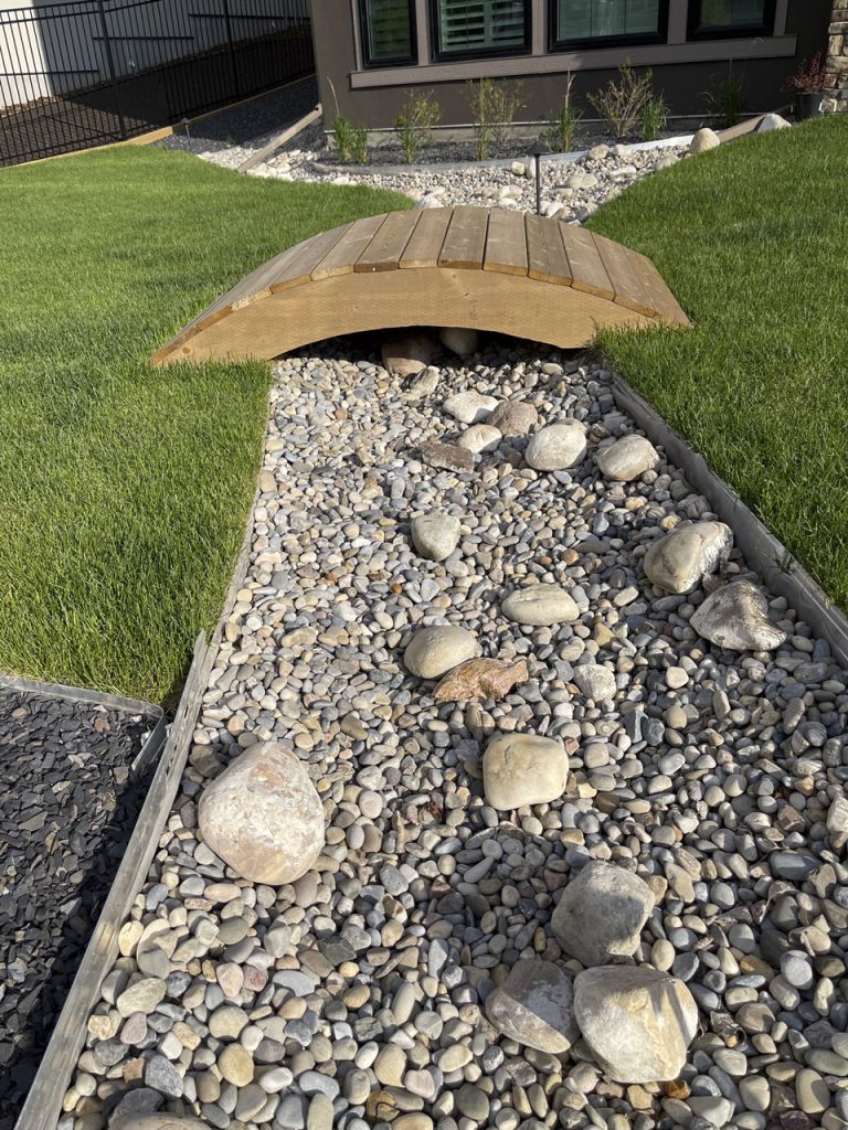 Small wodden bridge with landscaped backyard 768x1024