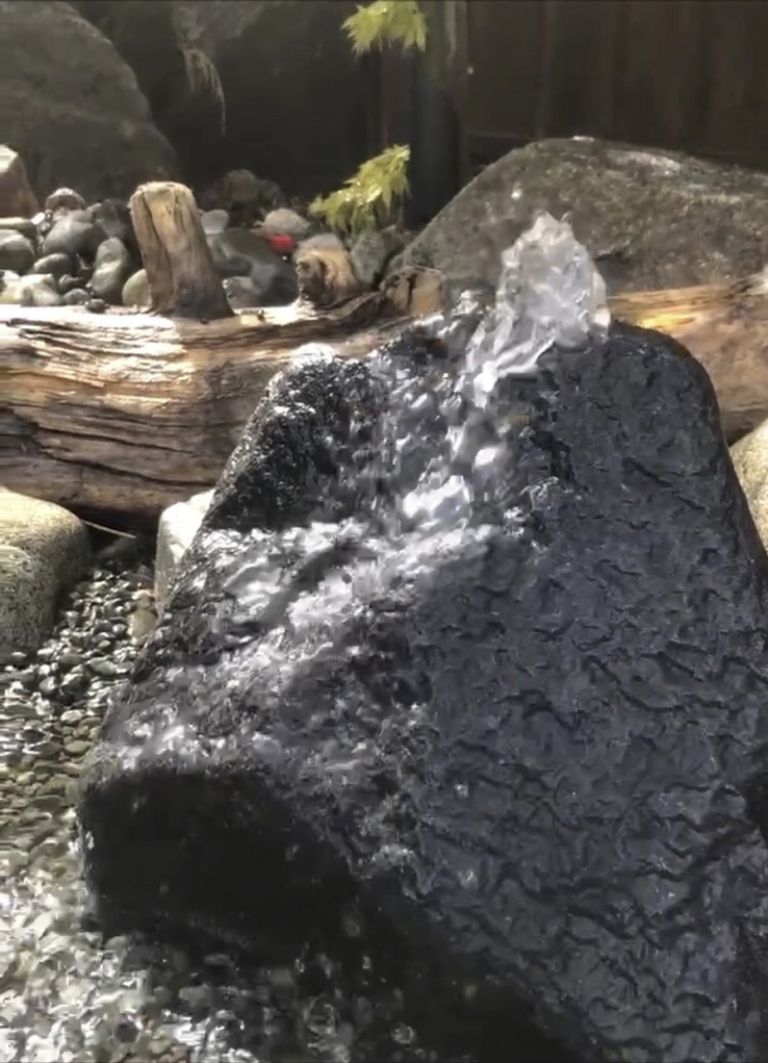 Stone water feature flowing 2 768x1063