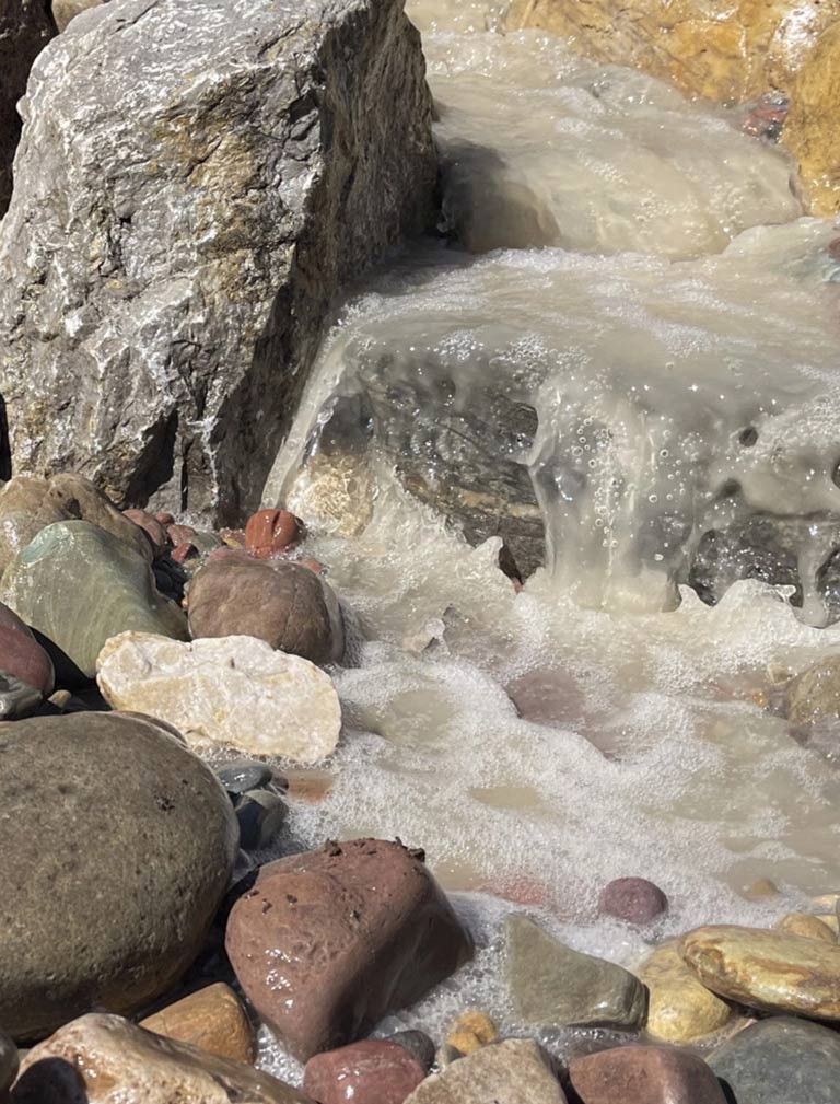 Water flowing over rocks mobile