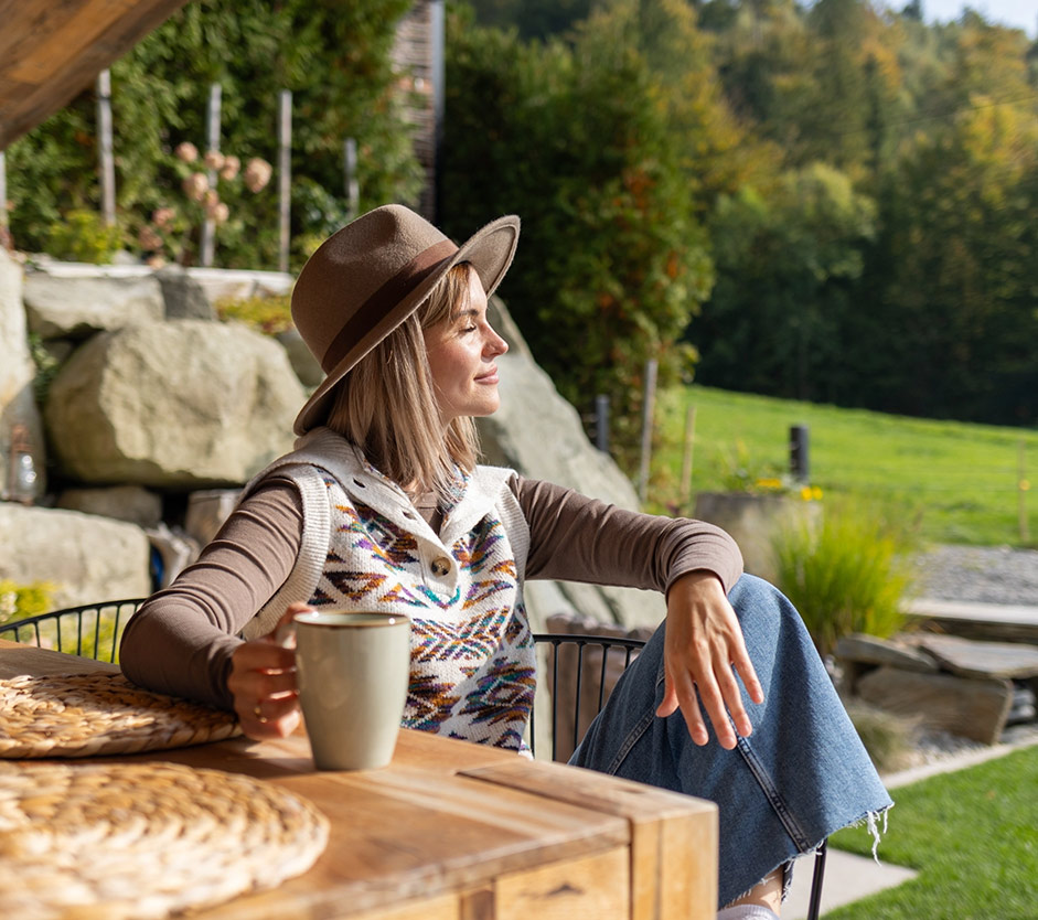 Woman enjoying sunny day in backyard